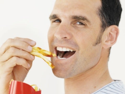 man eating fries