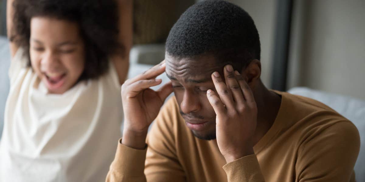 Man Wonders If He’s Wrong For Never Telling His Parents He Had A Child & Refusing To Care For His Daughter Frustrated parent massages temple