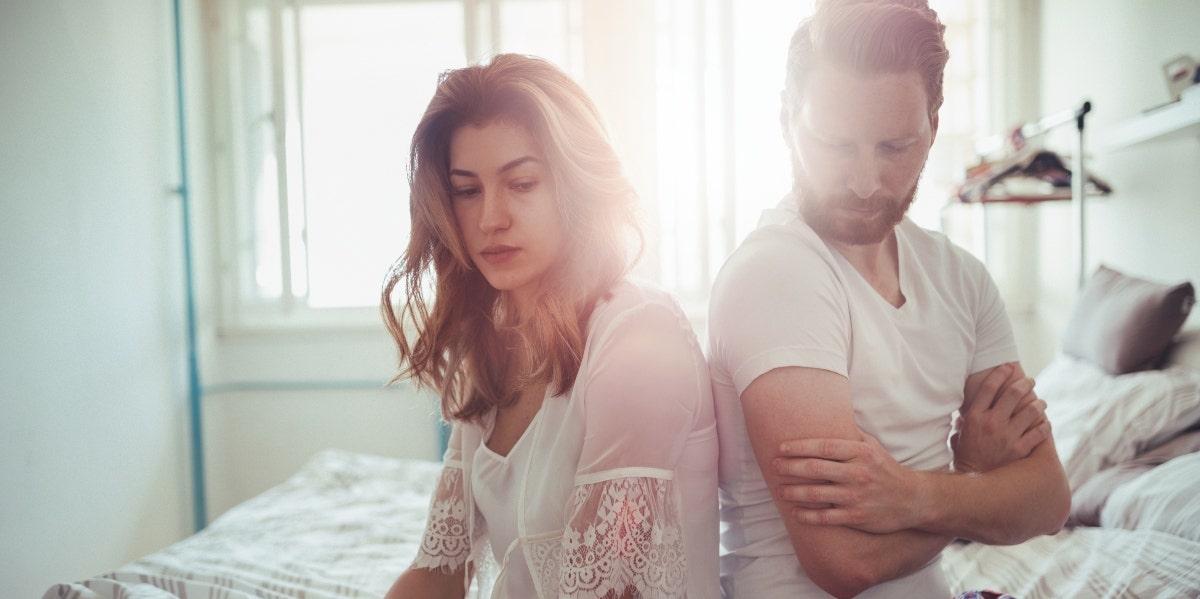 frustration-aggression principle fighting man and woman sitting back to back