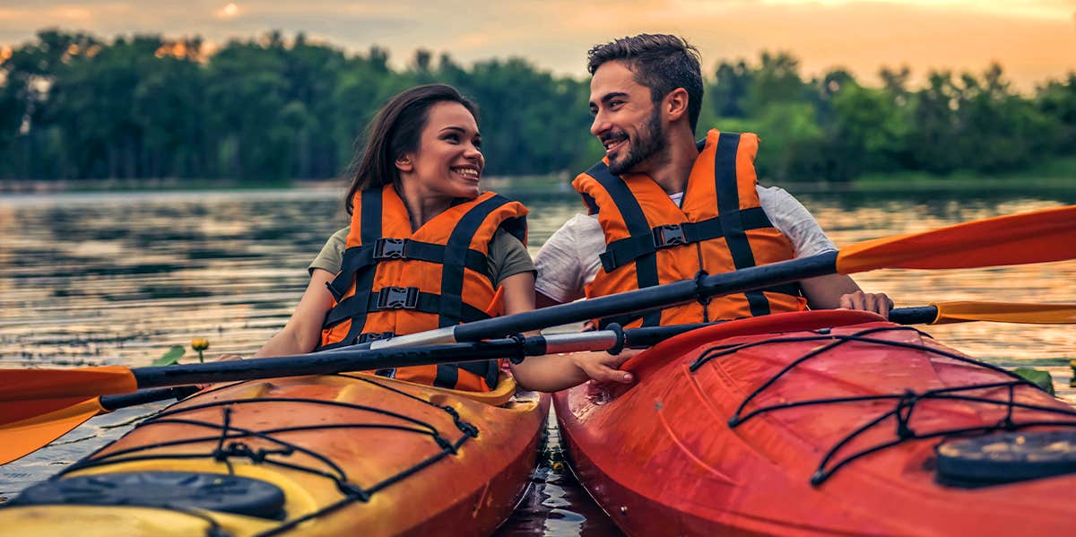 man and woman kayaking together