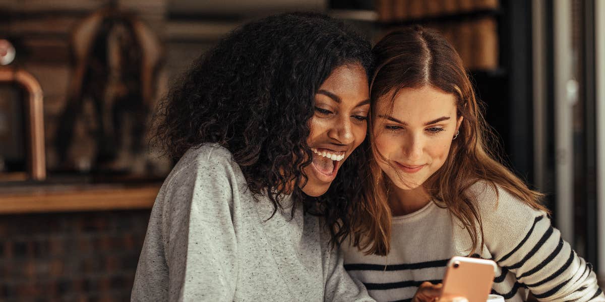75 Funny Things To Ask Siri To Crack Yourself Up two girls laughing at phone