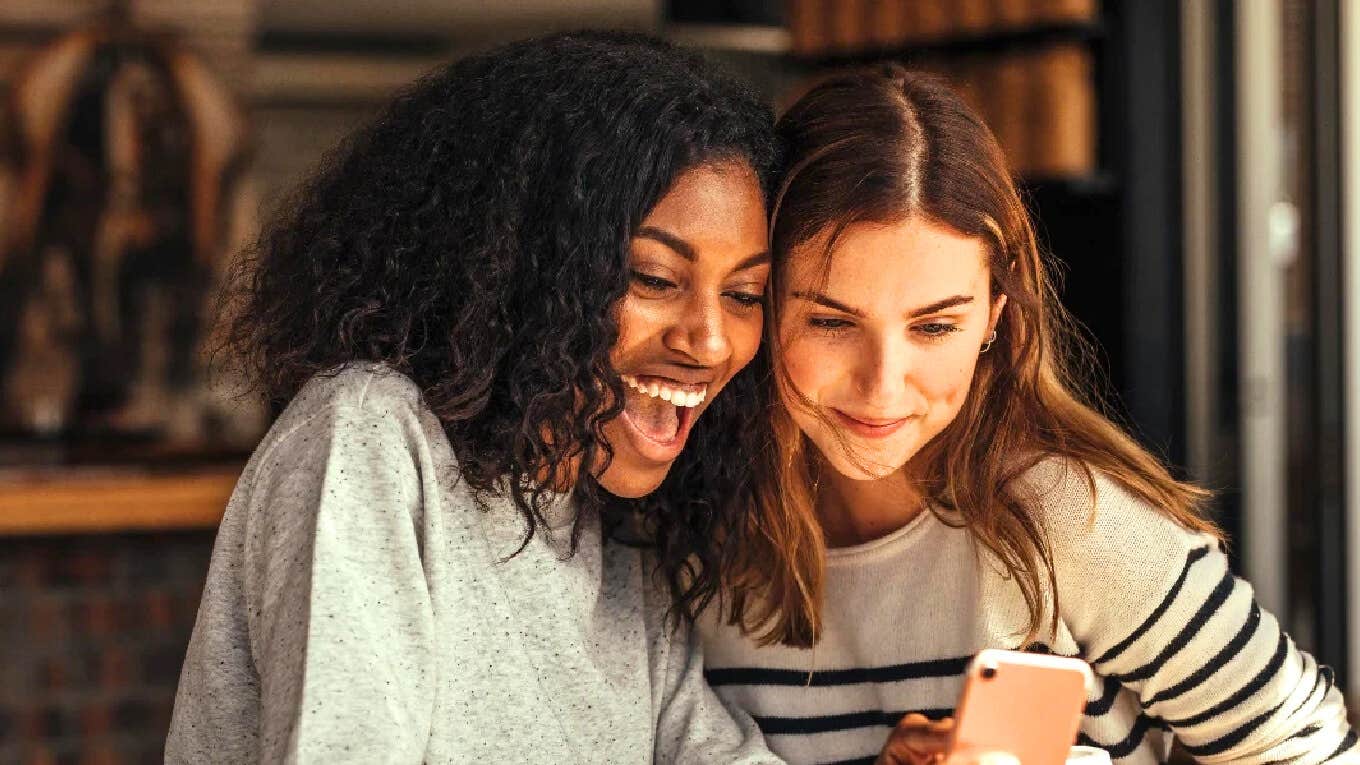 Funny Things To Ask Siri For A Good Time Cracking Yourself Up two friends having a good time asking Siri funny things