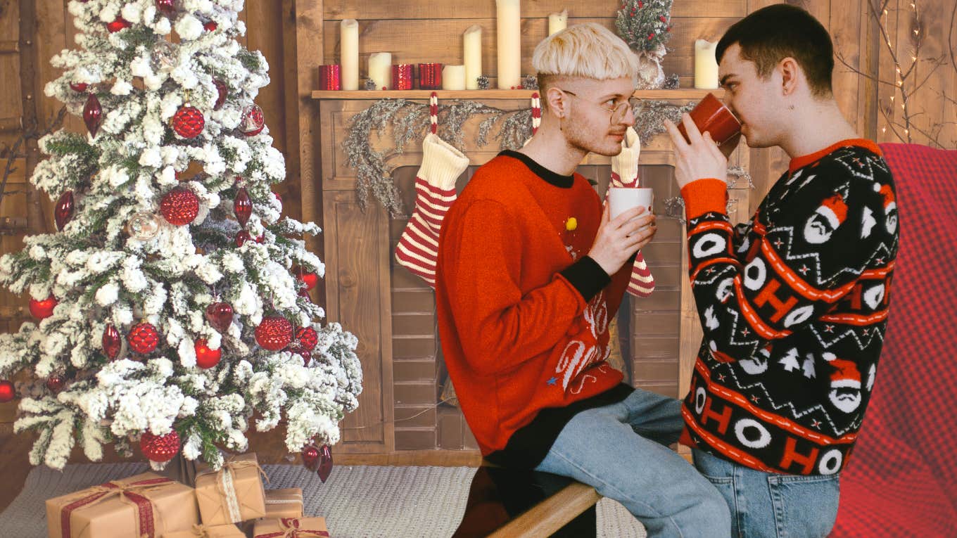 Man Bought Gifts For Everyone In His Partner's Family Except His Mother-In-Law Two men drinking coffee and talking near a Christmas tree