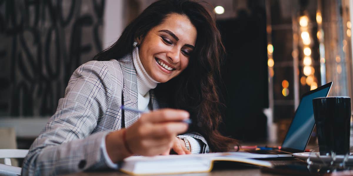 intelligent woman doing work at desk