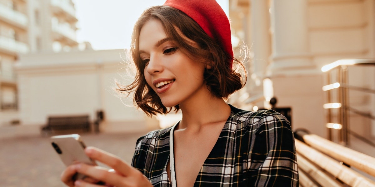 woman looking at ger phone