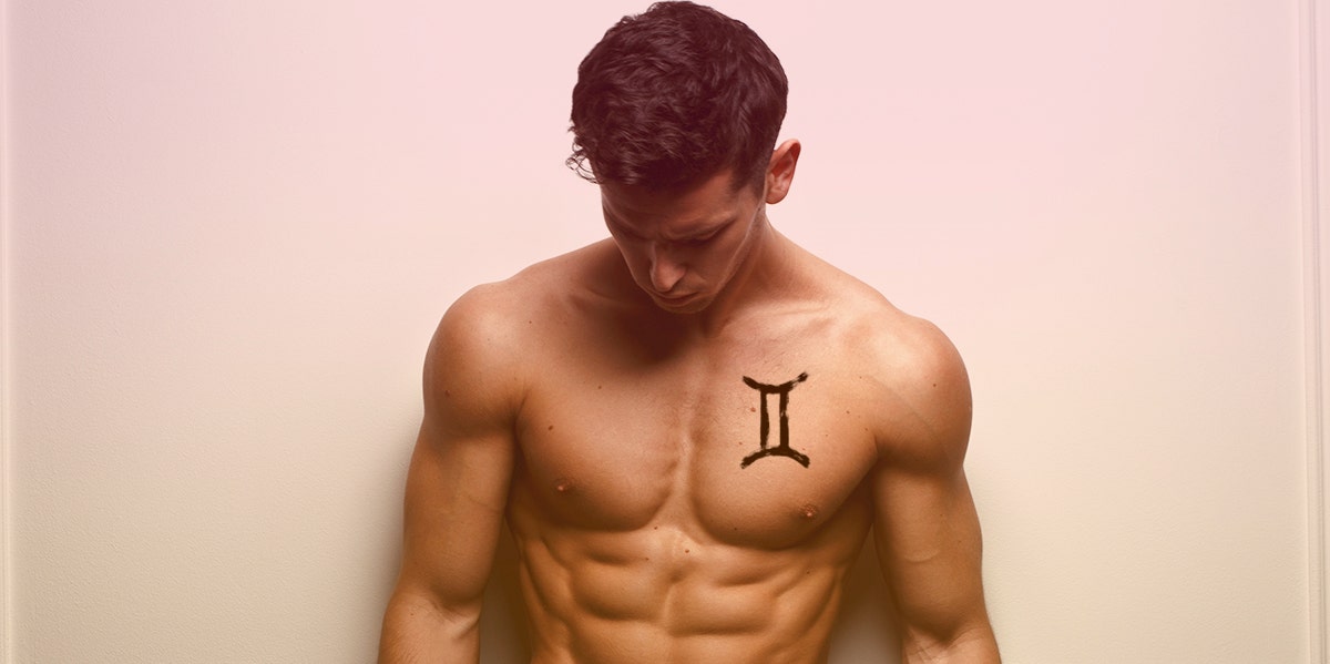 man with gemini symbol tattoo on chest