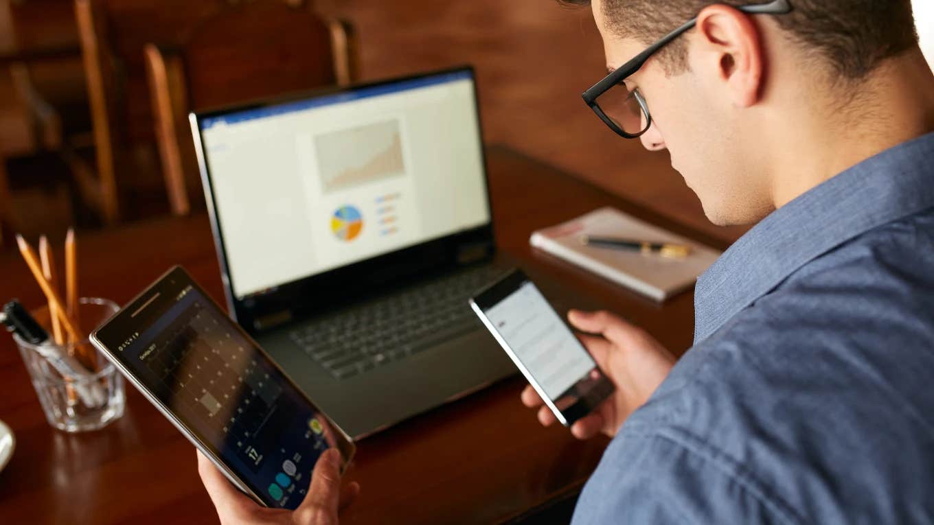 man working three full-time remote jobs