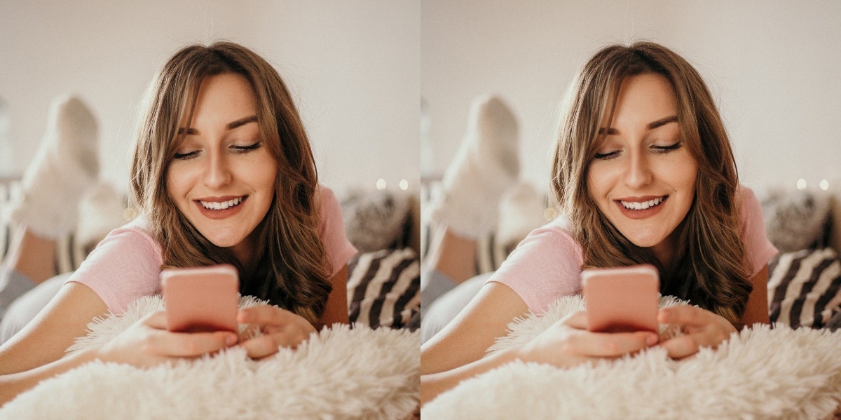 woman laying on a bed texting