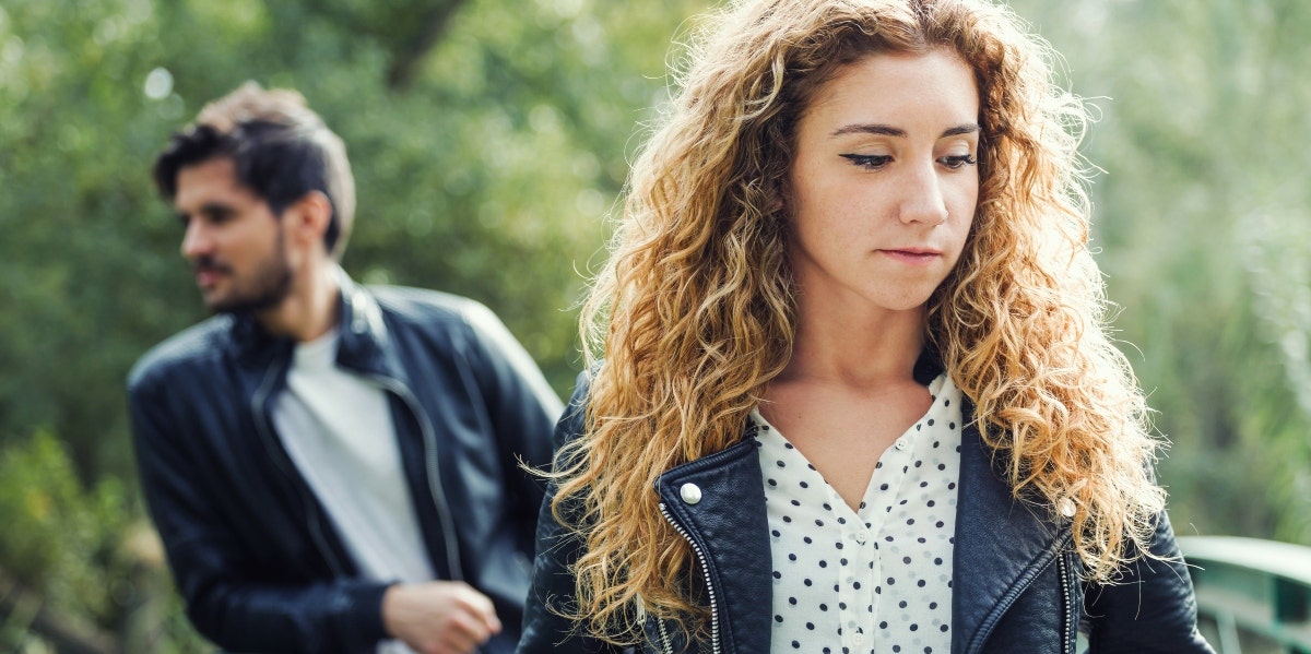 get over a narcissist sad looking woman with man behind her