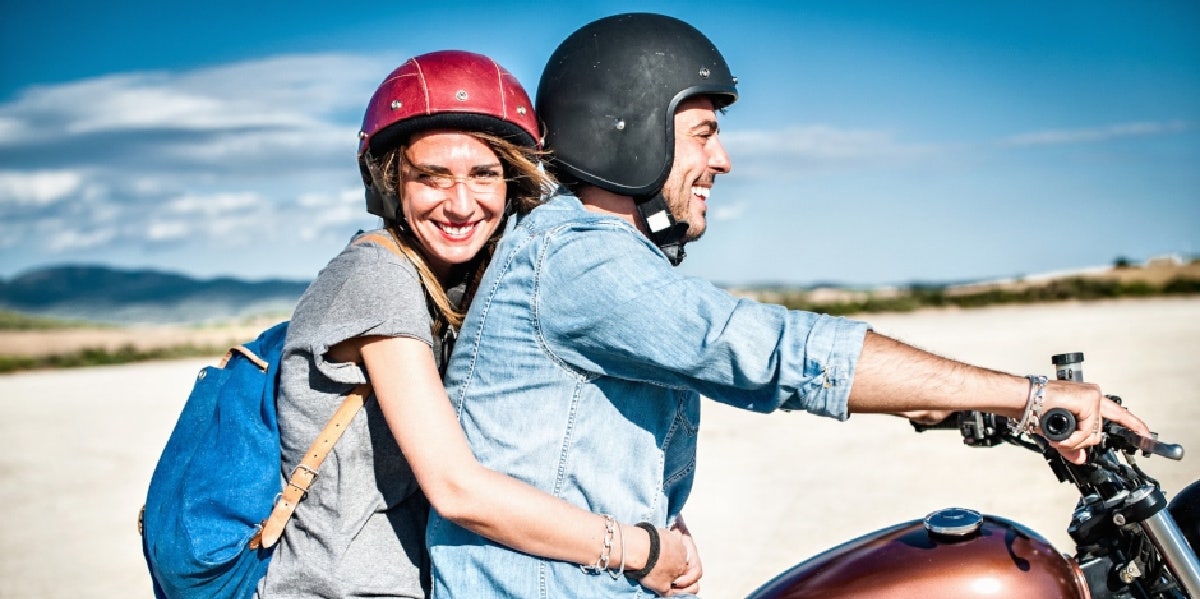 woman grabbing man on bike 