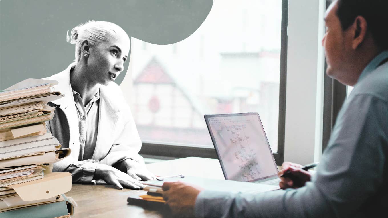 Woman meeting with a divorce lawyer, with paperwork 