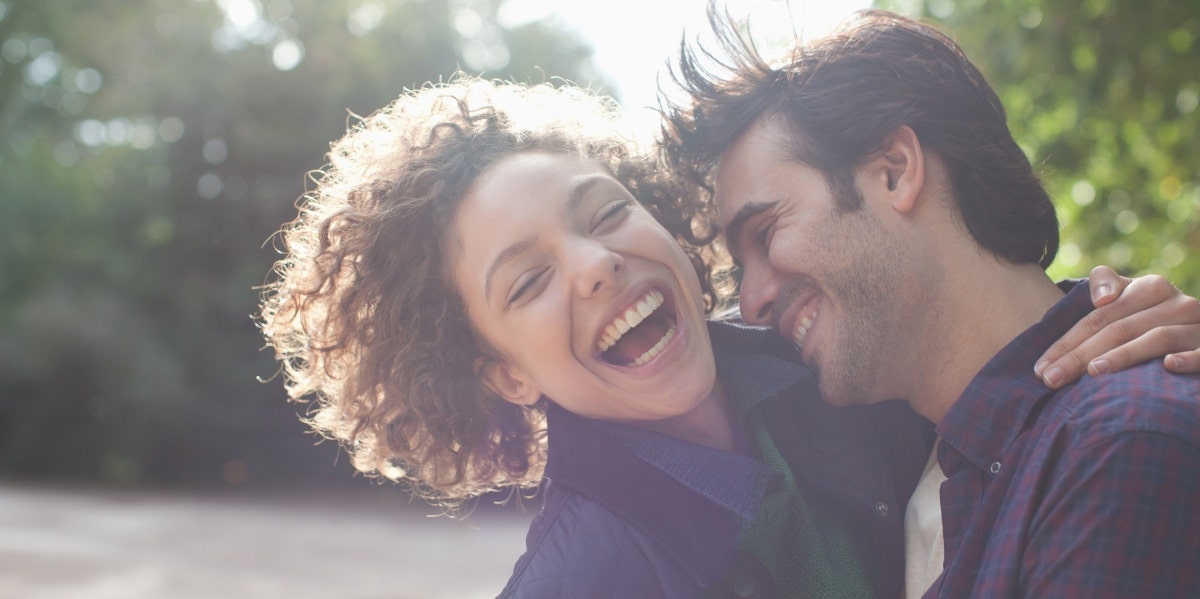 happy man and woman hugging