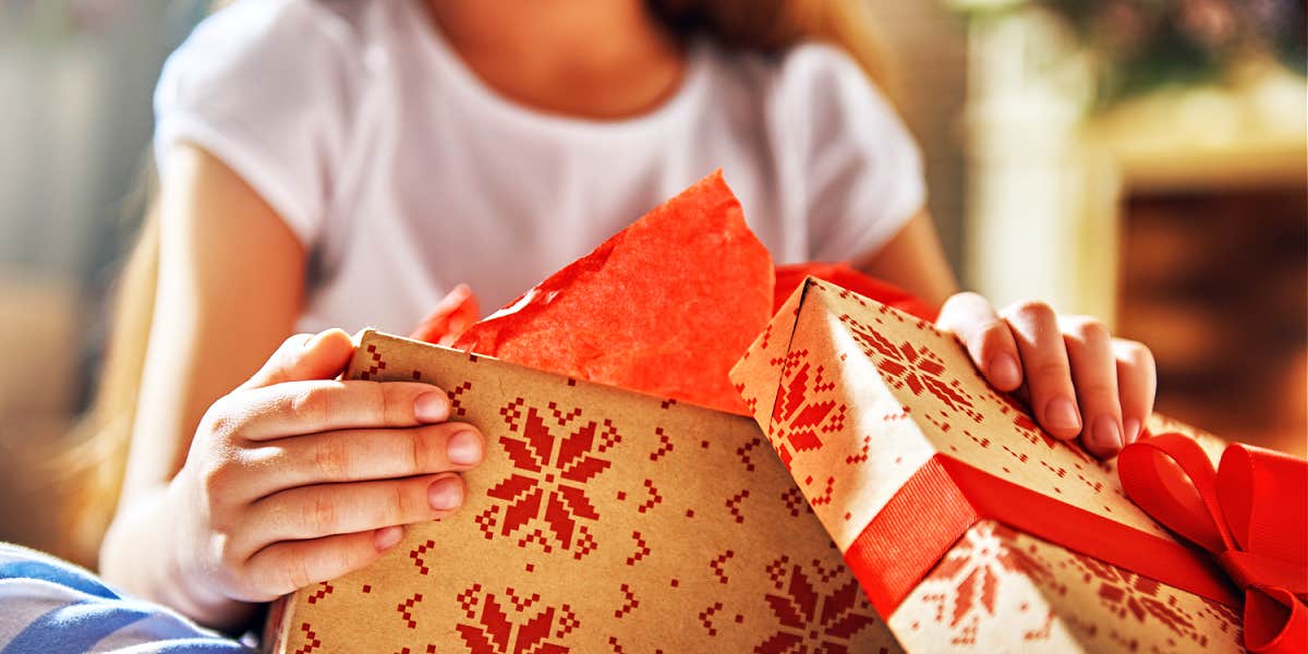 teen girl opening a gift