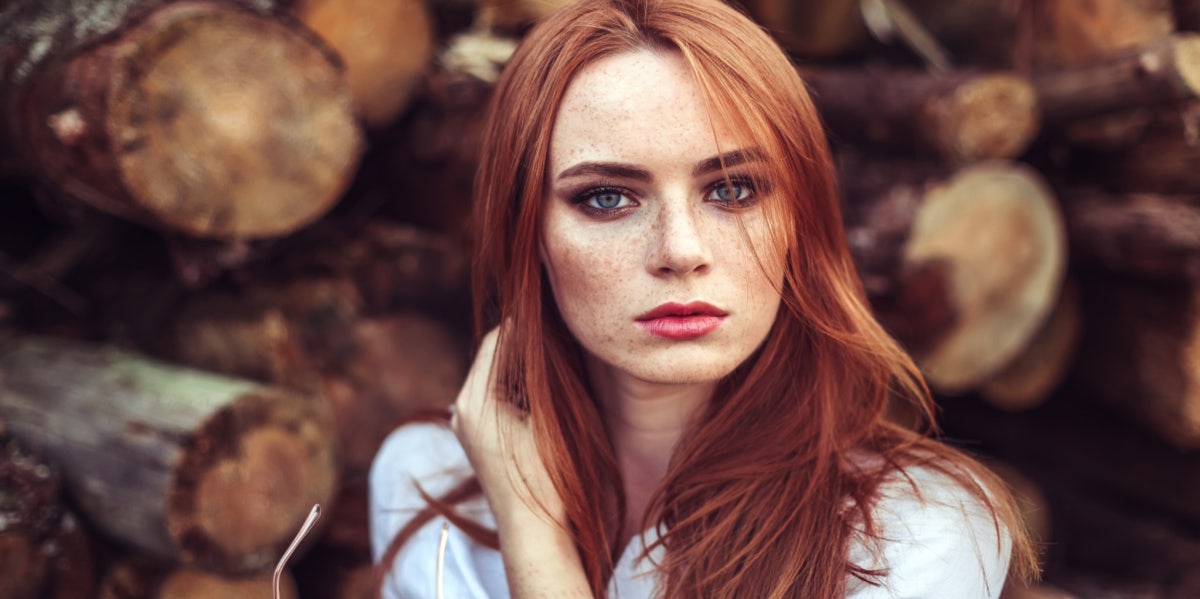 red head woman sad somber looking forward