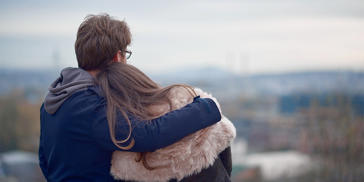 man and woman embracing