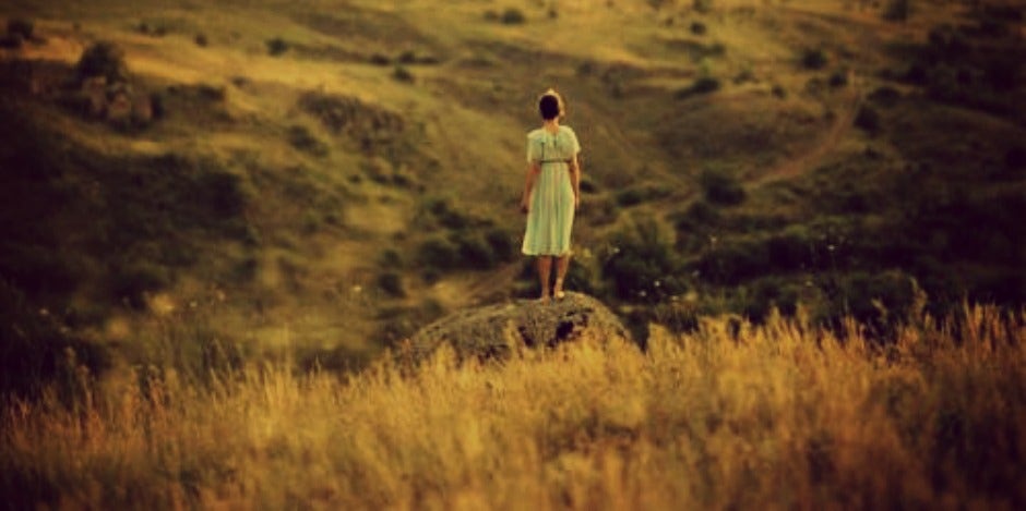 girl standing on the plains girl standing on the plains