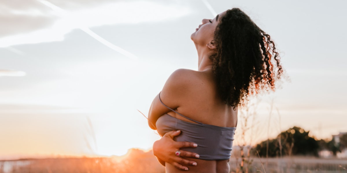 woman hugging herself