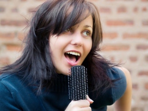 girl singing hairbrush
