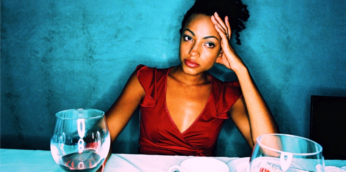Why The Isn't Glass Half Full Or Half Empty — It's Refillable negative woman at table