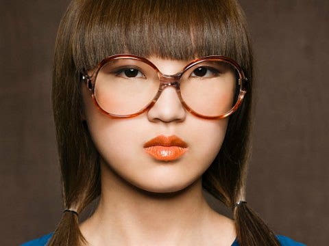 asian woman with large glasses