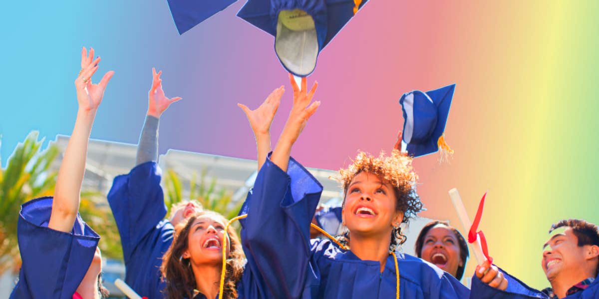 graduates throwing graduation caps in the air