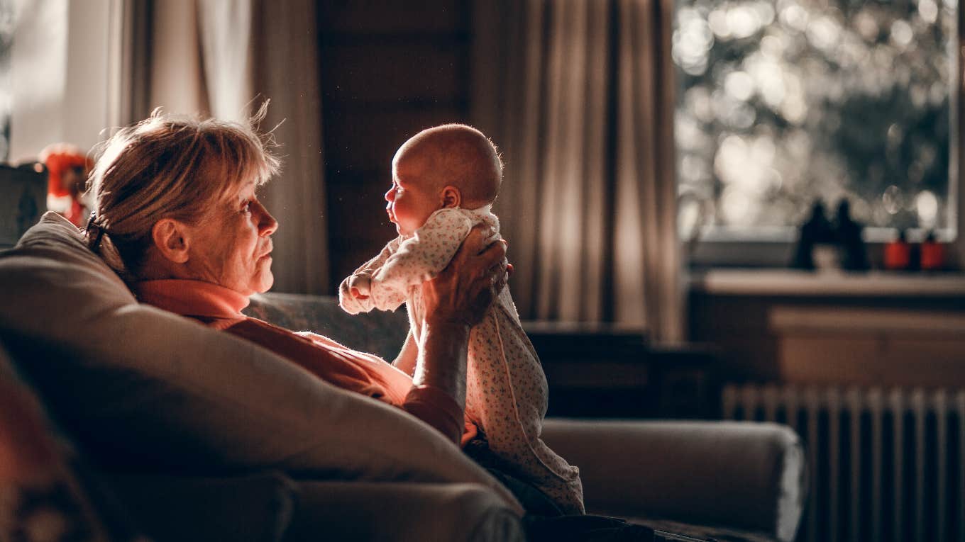 grandmother holding newborn grandkid