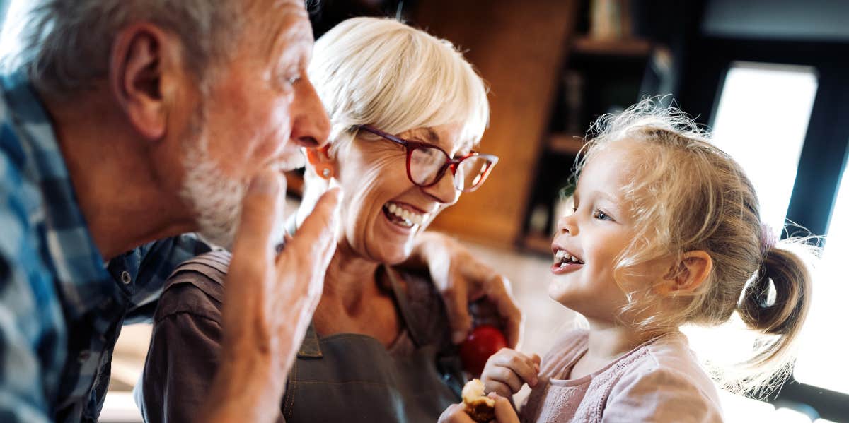Woman Tells Her Parents That Brother's Child Is Not Biologically His After They Show Favoritism grandparents with granddaughter