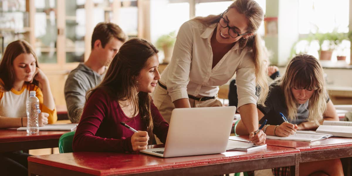 teacher helping student