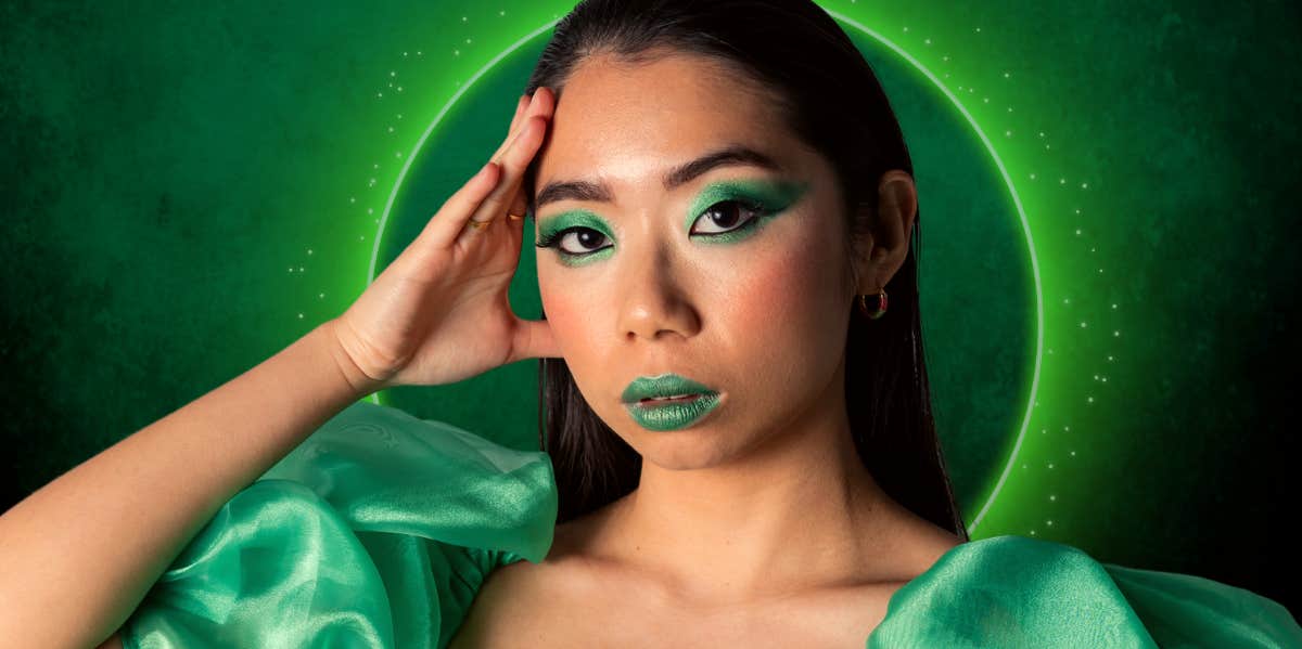 Green Aura Meaning: Personality Traits, Relationships & Career woman with all green