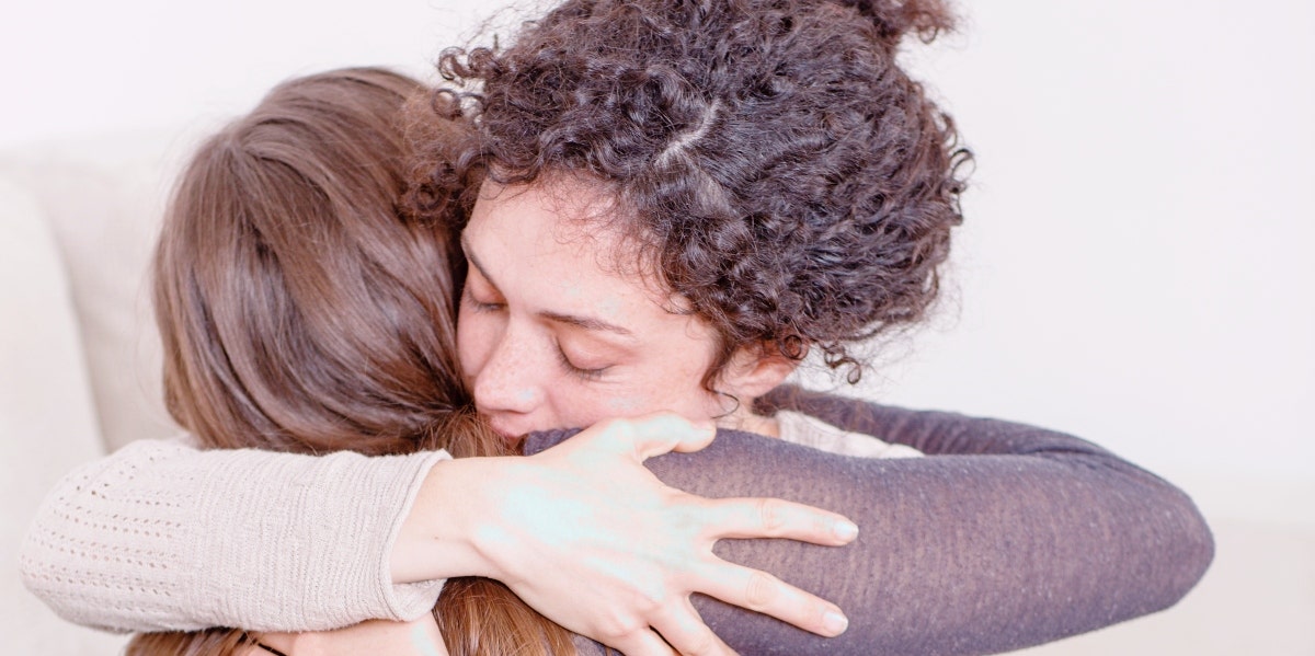 grief after suicide two women hugging