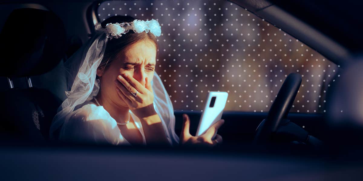 bride crying in car looking at her phone