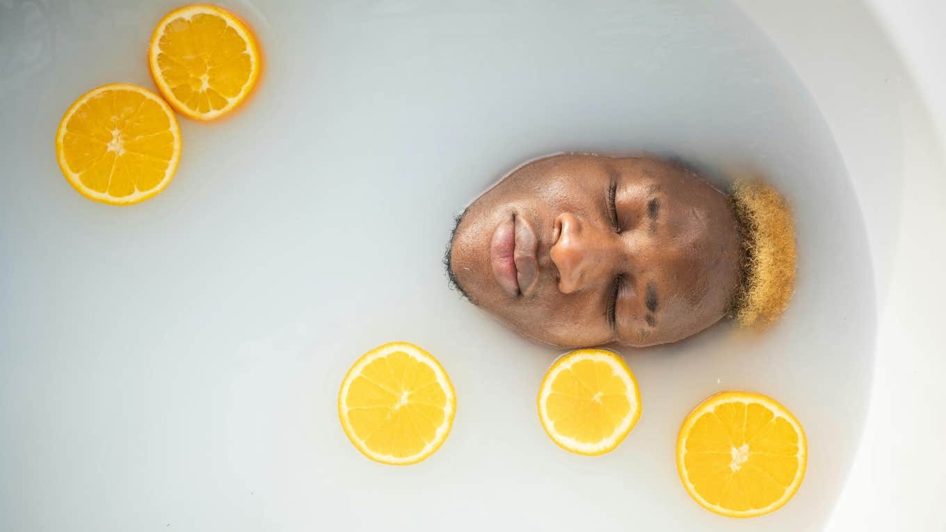 guy in a bathtub with orange slices 