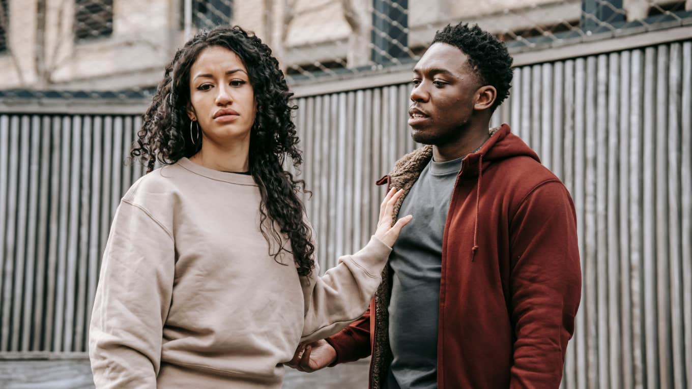 If A Guy Says Any Of These 12 Phrases, 'Run Before You Even Knew How To Crawl' woman pushing a man away