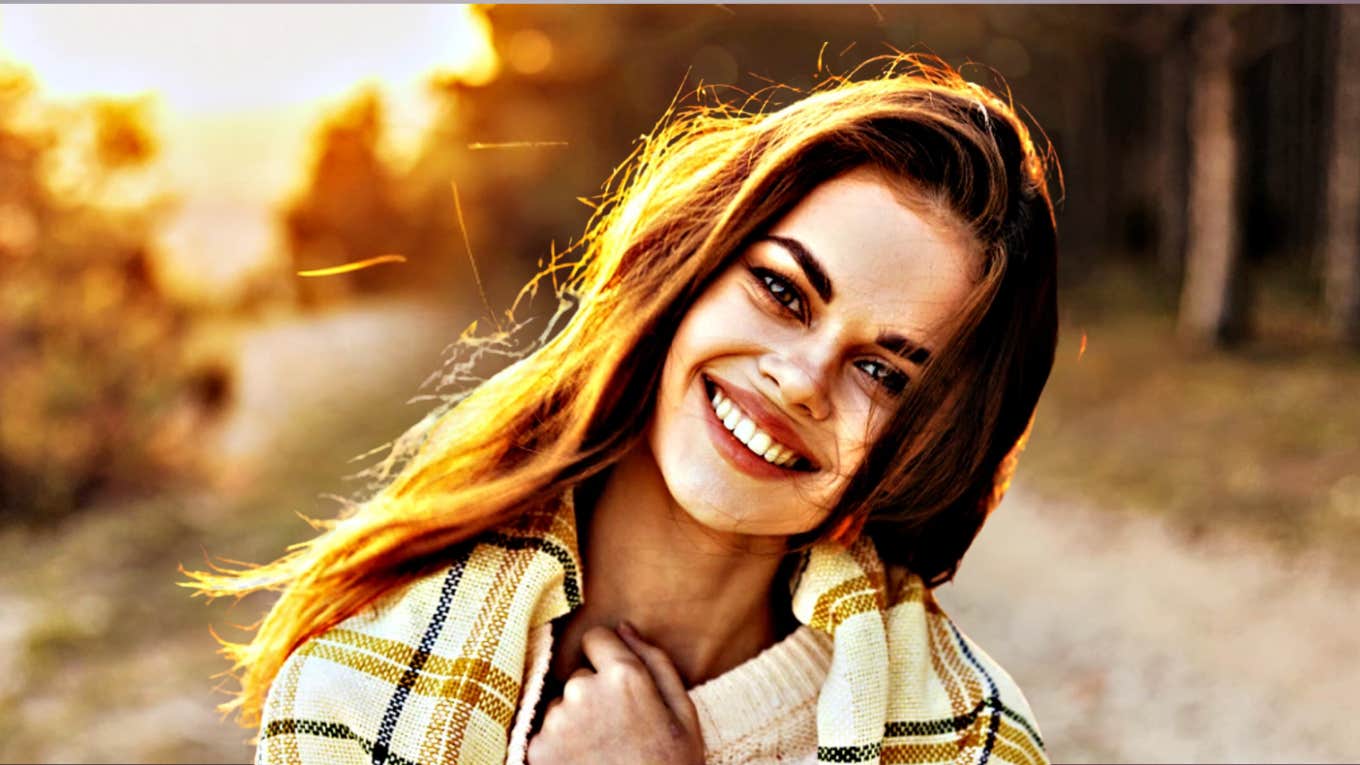 Daily Habits For Building A Happier, More Peaceful Life Glowing happy young woman on country road