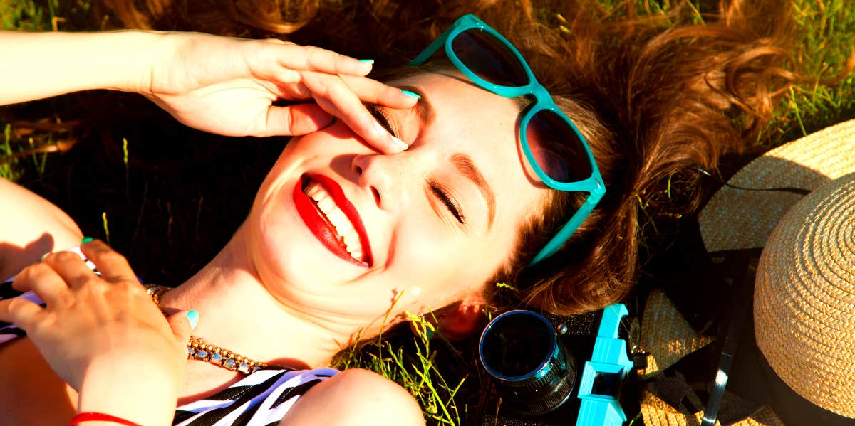 Joyful woman lying down