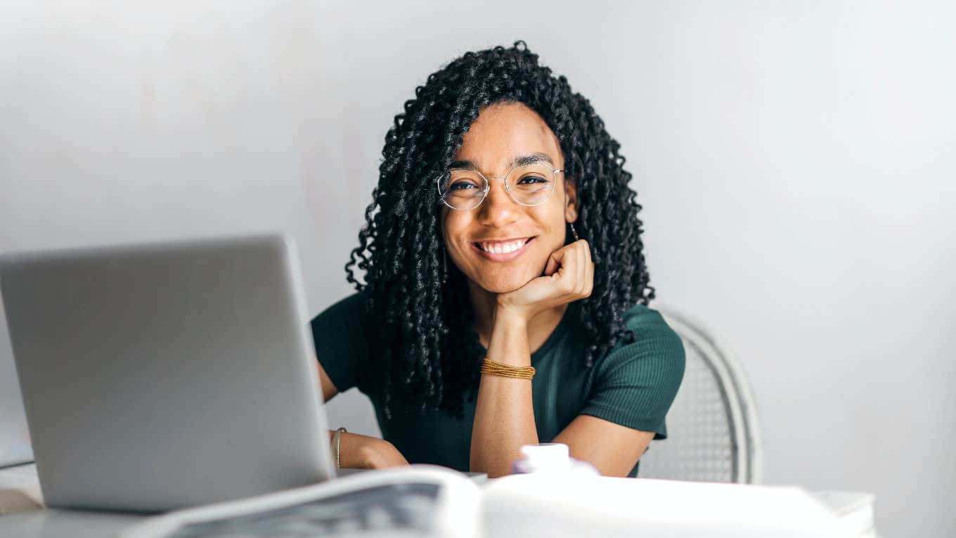 woman smiling at computer