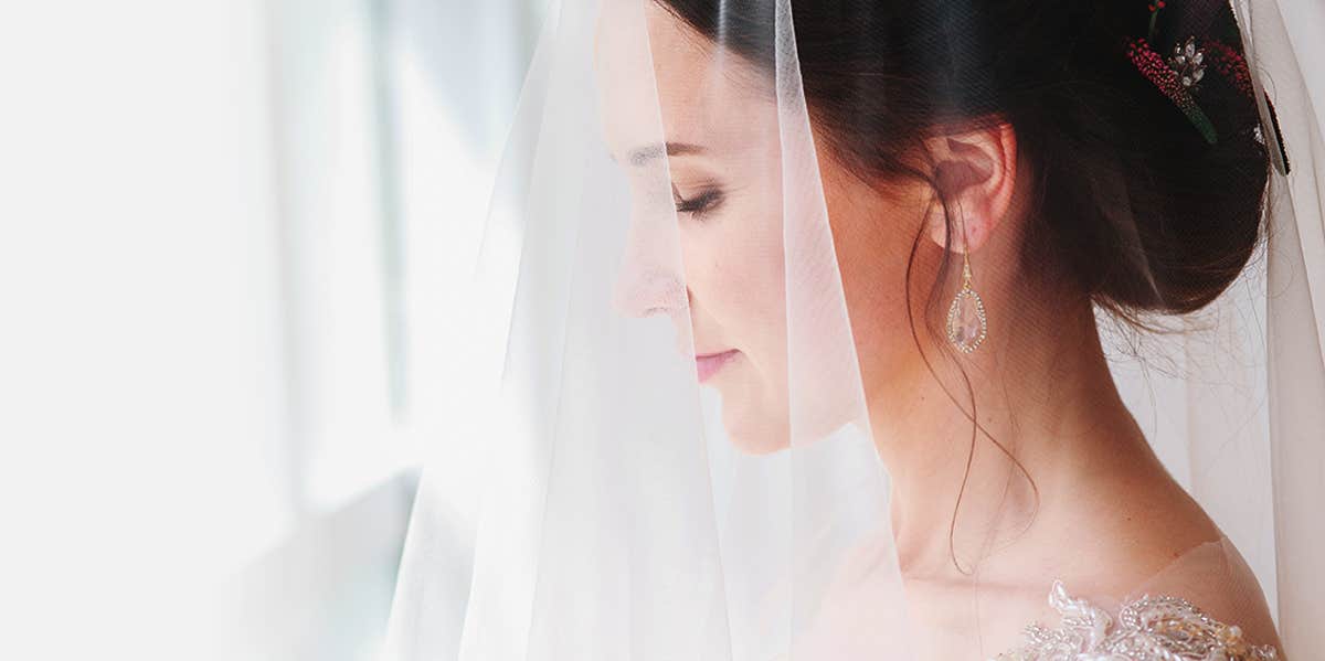 bride standing near window