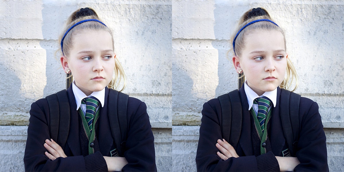 child with ponytail wearing a suit