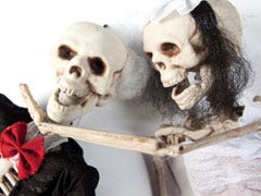 skeleton couple in tux and dress
