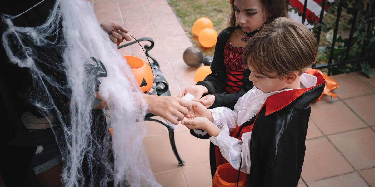 Kids in Halloween costumes trick-or-treating