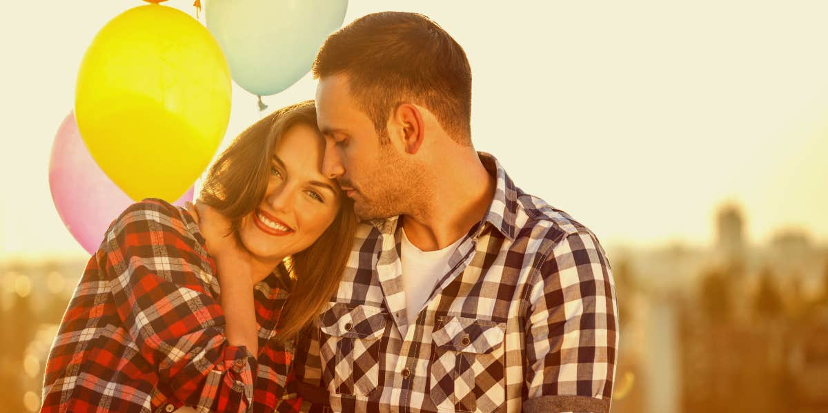 Loving couple with balloons