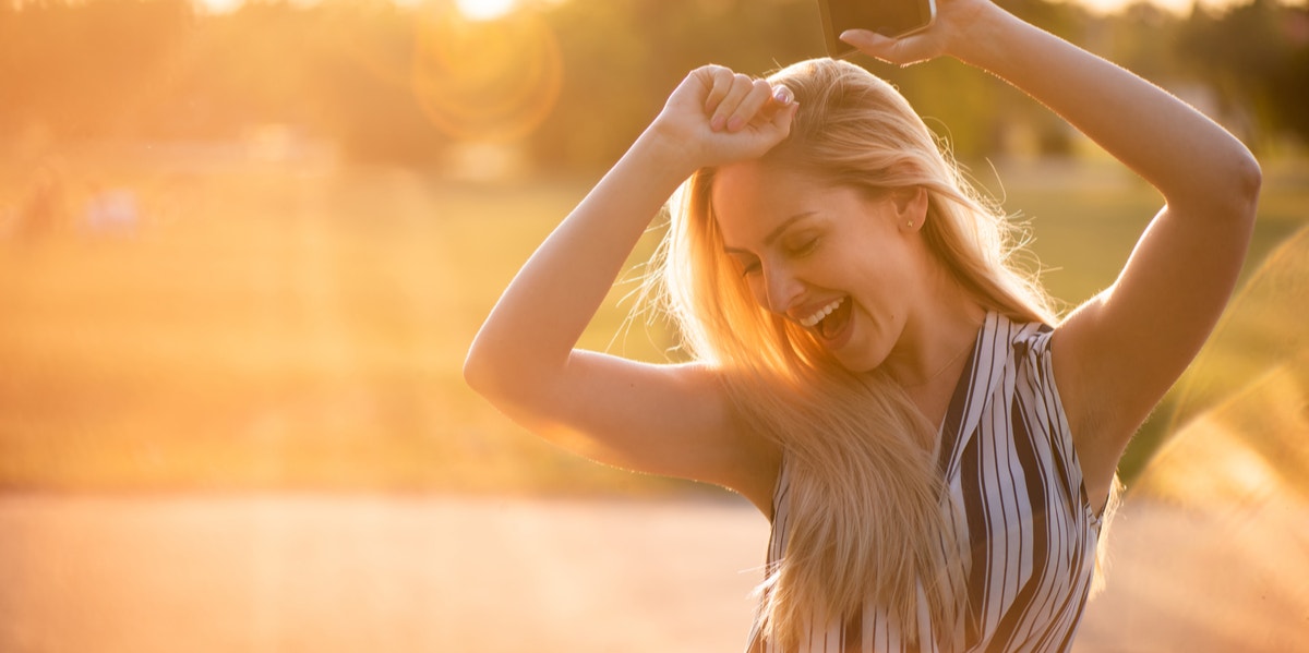 woman dancing in sunlight