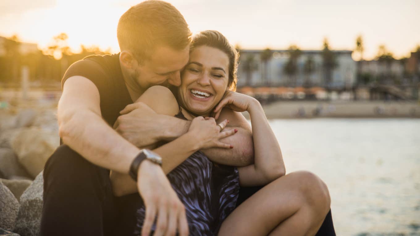 Happy Couples In Healthy Relationships Have 11 Things In Common couple smiling and embracing