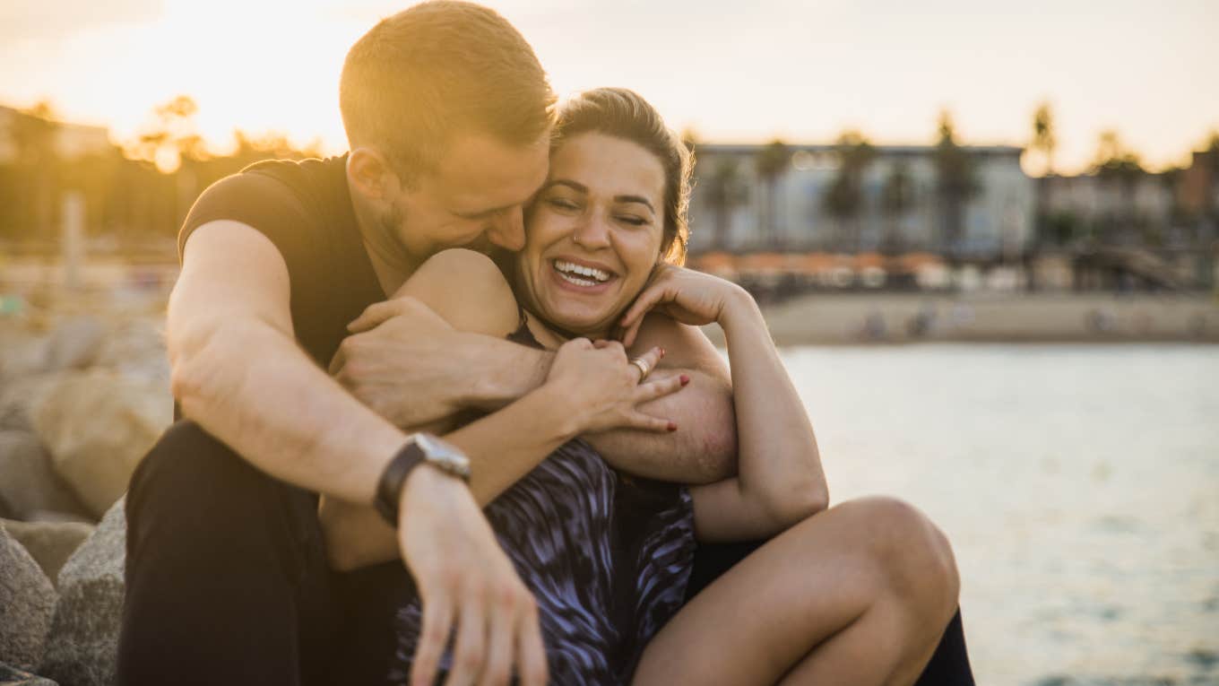 couple smiling and embracing