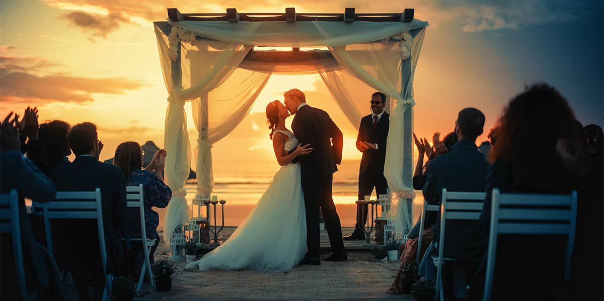 5 Hard Truths About Being In A Traditional Marriage, As Told By A Divorce Coach couple getting married