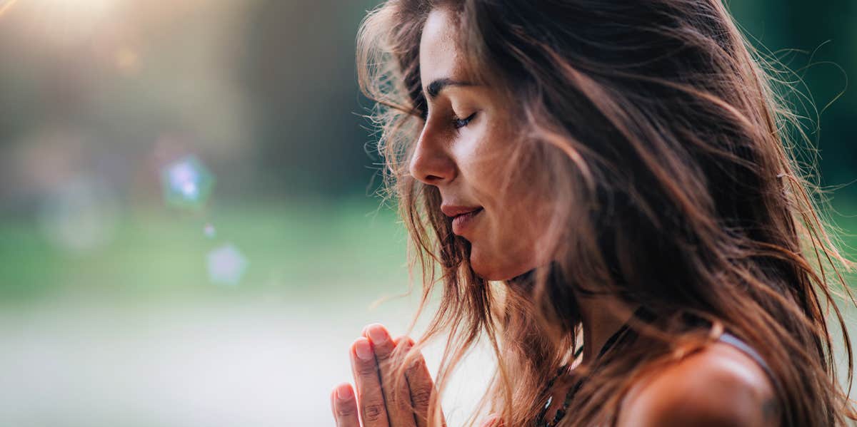 spiritual woman with hands together