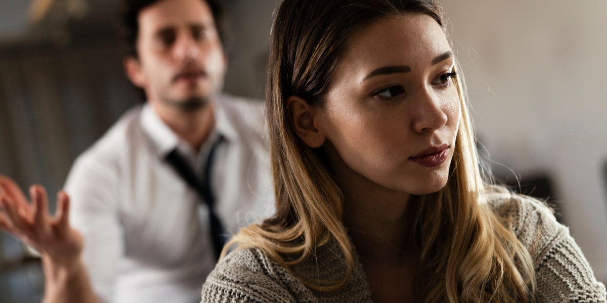 upset woman with a man bugging her