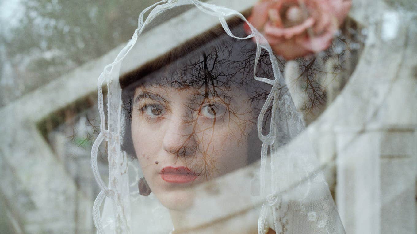 Woman staring out in wedding dress 