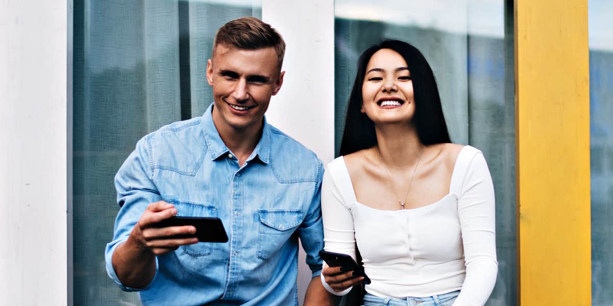 man and women sitting outdoors in front of windows