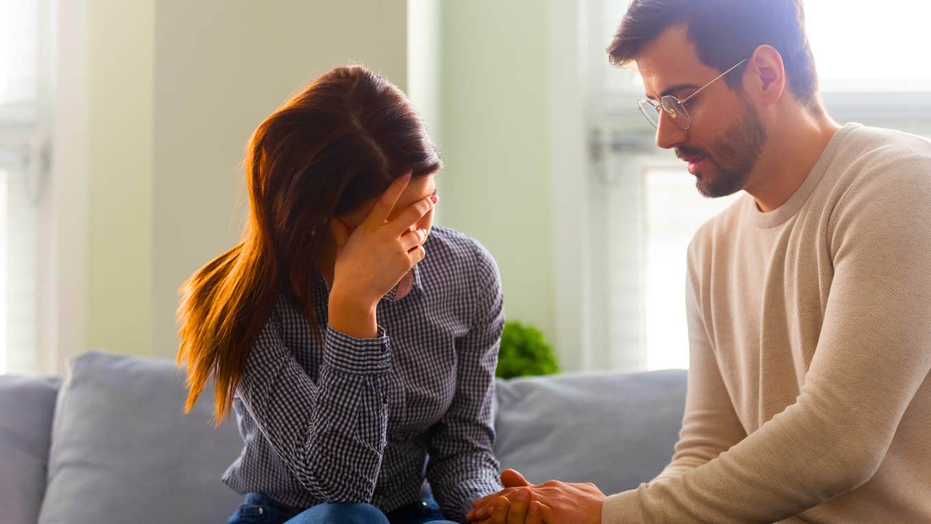 man comforting woman he cheated on